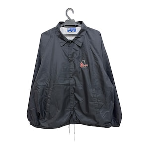 May include: Black coach jacket with a button-up front, collar, and drawstring hem. Features a small logo in red and white on the chest. The jacket is hanging on a black hanger against a white background.