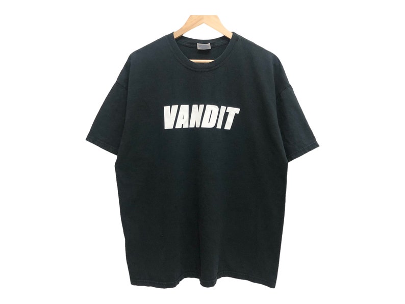 May include: Black t-shirt with a white "VANDIT" graphic printed on the front.
