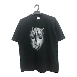 May include: Black t-shirt featuring a grayscale mask design with the text "BUIDOMEGA" above it. The mask has a split face with one side showing a detailed eye and the other side a more abstract design.