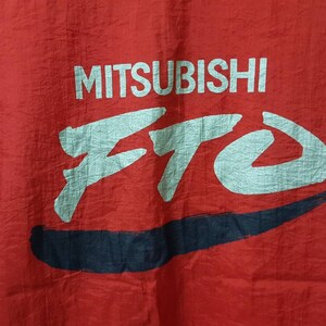 May include: Red jacket with a white and blue logo that says "MITSUBISHI ETO".