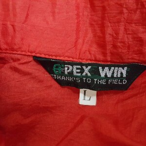 May include: A red jacket with a black tag that says "GPEX WIN THANKS TO THE FIELD" and a size "L" tag.