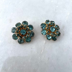 Vintage blue rhinestone gold tone clip on earrings.