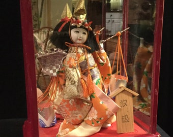 oriental dolls in glass cases