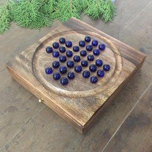 Wooden Handmade Solitaire Board with Marble Game Set, Winter Holiday Indoor Brain Game Set with 33 Glass Balls Pegs, New Year Day Gift Set
