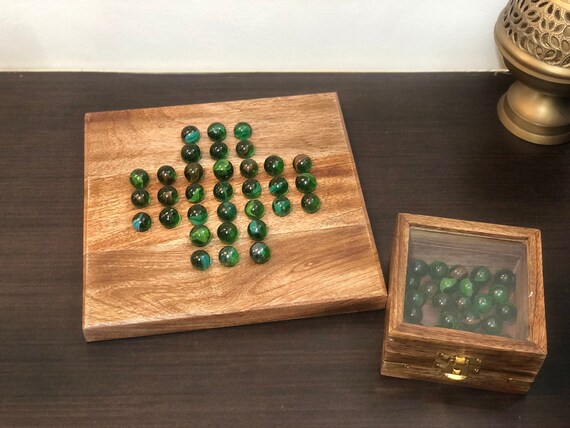 Game with flat marbles and hotsell wooden board
