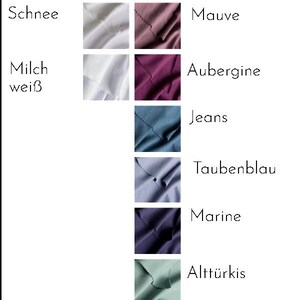 K&ouml;nnte beinhalten: Eine Farbkarte mit Stoffmustern in verschiedenen Farbt&ouml;nen. Die Karte enth&auml;lt Farben wie Avocado, Dunkelgrau, Schwarz und Wei&szlig; sowie Optionen wie Gelb, Altgold und Dunkelrot. Der Text beschriftet jede Farbe.