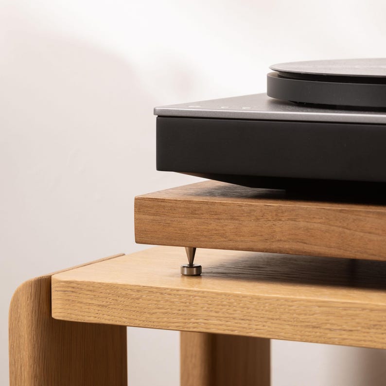 Solid walnut noise isolation platform with brass or chrome spike feet. This is for your turntable or amplifier to reduce vibration and enhance audio quality.
