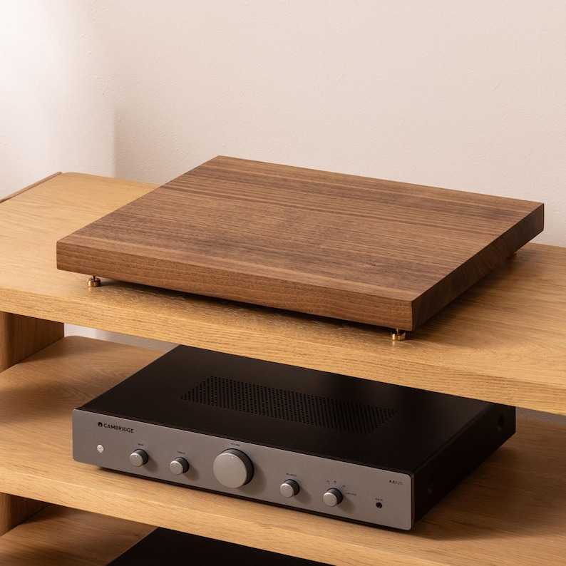 Solid walnut noise isolation platform with brass or chrome spike feet. This is for your turntable or amplifier to reduce vibration and enhance audio quality.