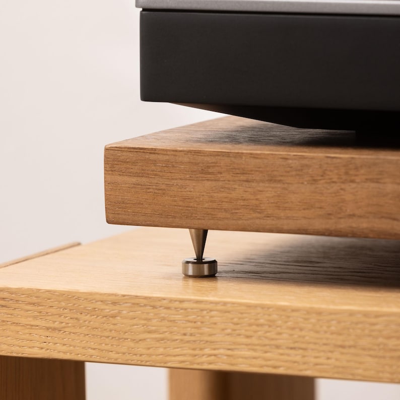 Solid walnut noise isolation platform with brass or chrome spike feet. This is for your turntable or amplifier to reduce vibration and enhance audio quality.