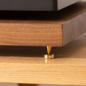Solid walnut noise isolation platform with brass or chrome spike feet. This is for your turntable or amplifier to reduce vibration and enhance audio quality.