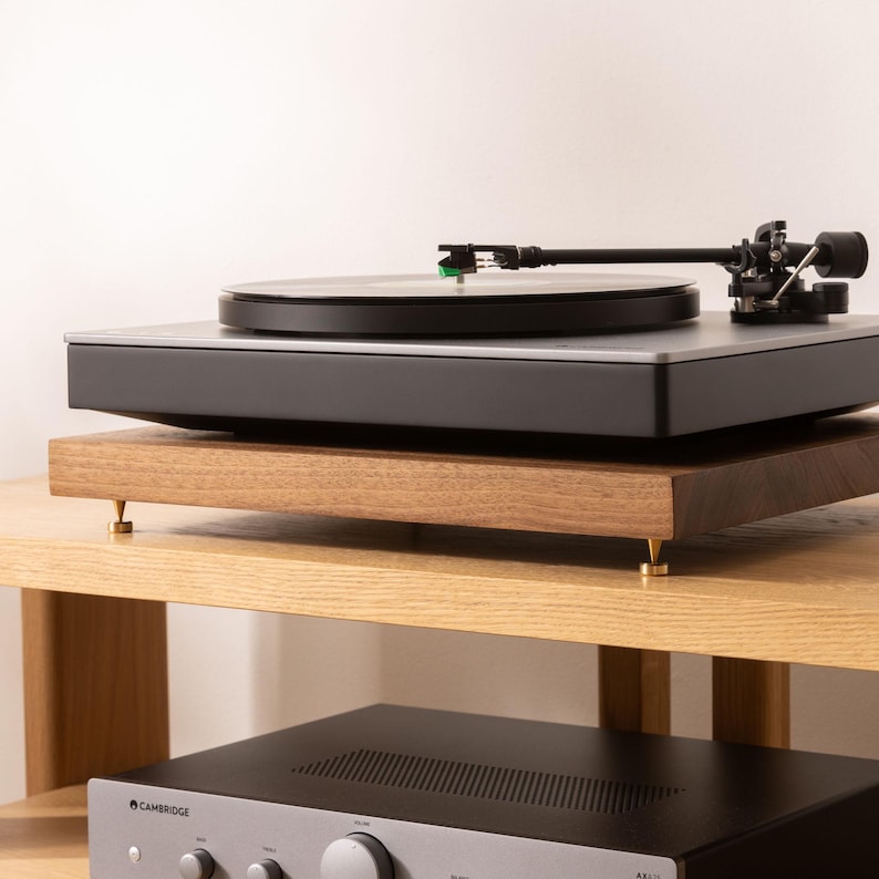 Solid walnut noise isolation platform with brass or chrome spike feet. This is for your turntable or amplifier to reduce vibration and enhance audio quality.