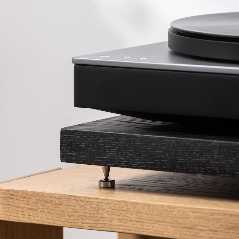 Black stained ash noise isolation platform with brass or chrome spike feet. This is for your turntable or amplifier to reduce vibration and enhance audio quality.
