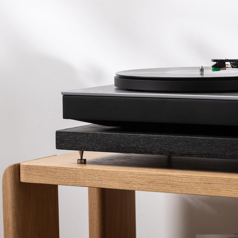 Black stained ash noise isolation platform with brass or chrome spike feet. This is for your turntable or amplifier to reduce vibration and enhance audio quality.