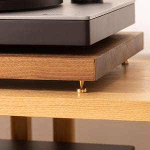 Solid walnut noise isolation platform with brass or chrome spike feet. This is for your turntable or amplifier to reduce vibration and enhance audio quality.