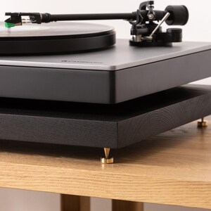 Black stained ash noise isolation platform with brass or chrome spike feet. This is for your turntable or amplifier to reduce vibration and enhance audio quality.