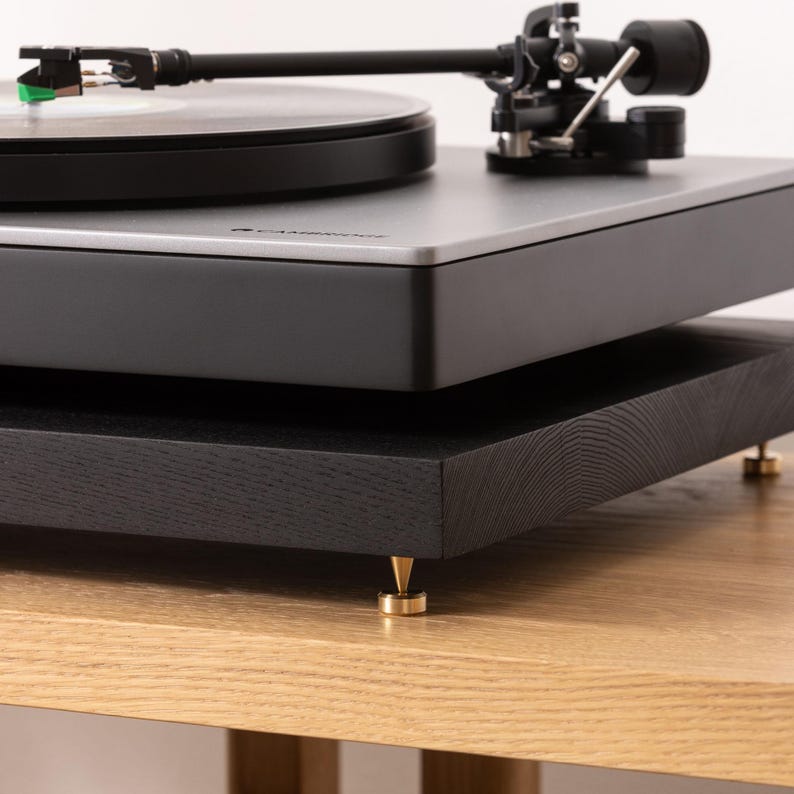 Black stained ash noise isolation platform with brass or chrome spike feet. This is for your turntable or amplifier to reduce vibration and enhance audio quality.