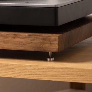 Solid walnut noise isolation platform with brass or chrome spike feet. This is for your turntable or amplifier to reduce vibration and enhance audio quality.