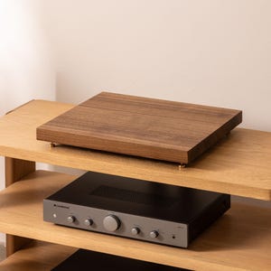 Solid walnut noise isolation platform with brass or chrome spike feet. This is for your turntable or amplifier to reduce vibration and enhance audio quality.