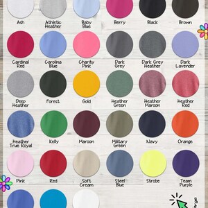 The image is a colorful collage of various colored t-shirts, each with different designs and styles. The t-shirts are arranged in rows and columns, showcasing a wide range of colors and patterns. The image does not contain any text, and the descriptions provided are based on the visual content of the collage.