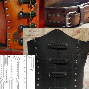 May include: Two leather corsets with metal buckles and rivets. The corset on the left is orange with a floral design and the corset on the right is black with a geometric design. A pattern for the corset straps is shown in the lower left corner.