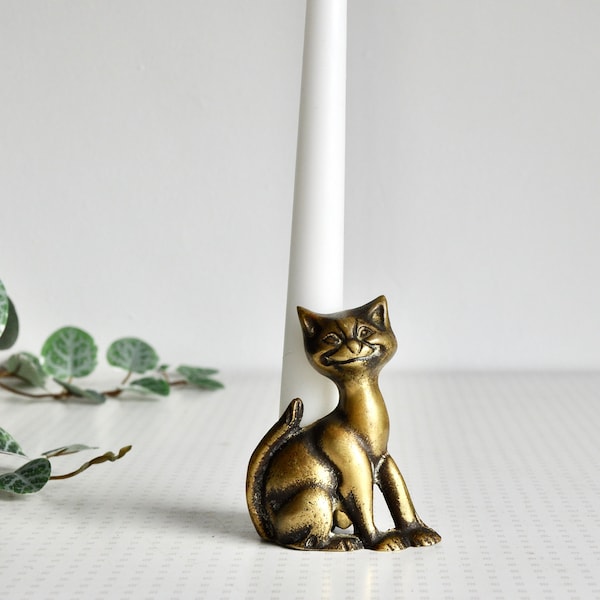 Vintage brass cheshire cat candlestick holder from the 1950s