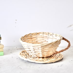 Vintage wicker tea cup shaped plant basket from the 1970s