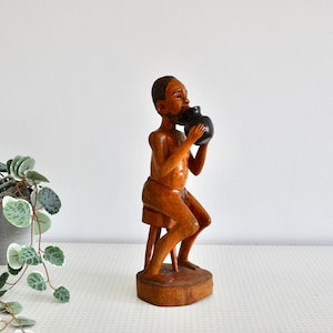 Vintage African carved wooden statue man from the 1970s