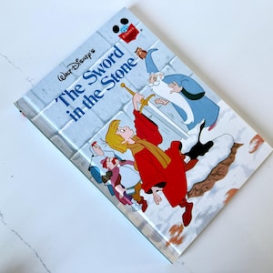 Vintage Walt Disney The Sword in the Stone book from 1986