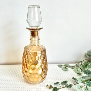 Vintage pale amber iridescent glass alcohol decanter from the 1960s