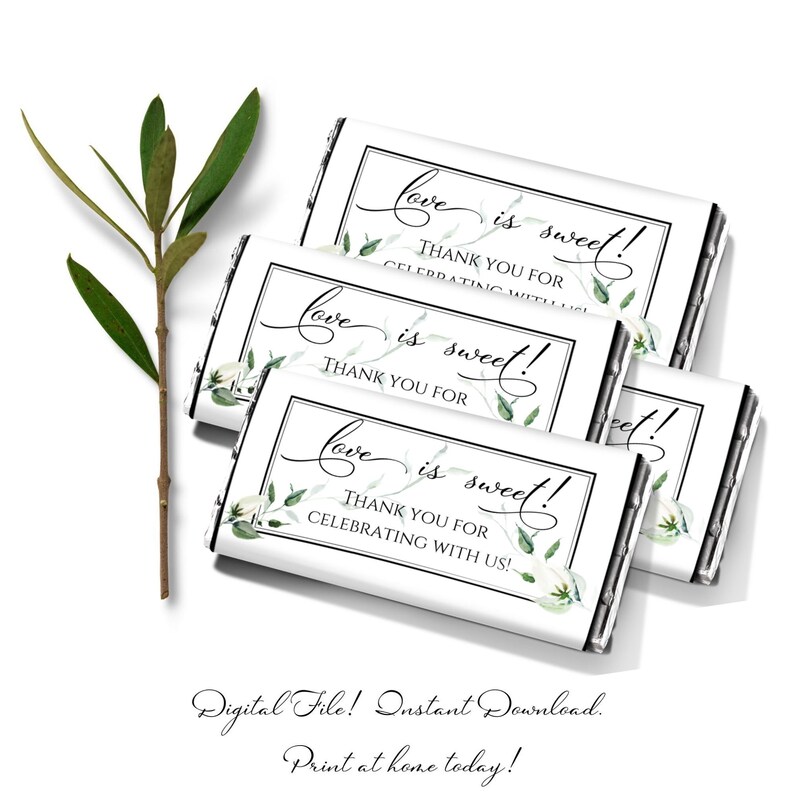 May include: Four white chocolate bar wrappers with a black border and green floral design. The text on the wrappers reads "Love is sweet! Thank you for celebrating with us!"