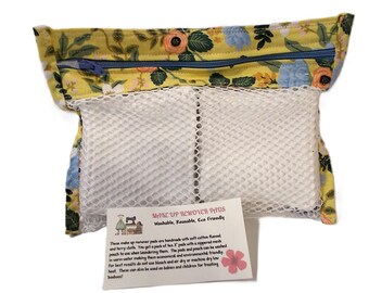 May include: A yellow floral zippered pouch with two white mesh makeup remover pads inside. The pouch has a label that reads "Make Up Remover Pads Washable, Reusable, Eco Friendly" and includes instructions for use and care.