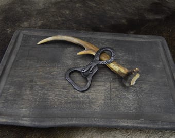 Hand Forged Jormungand Bottle opener.