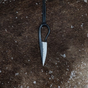 Hand forged viking woman&#39;s knife pendant, with high quality elk leather string.