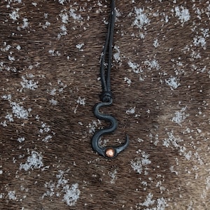 Hand forged flame of change necklace, with high quality elk leather string.