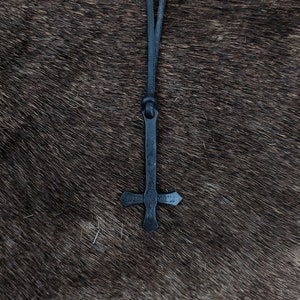 Hand forged inverted cross, with high quality leather string included.