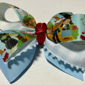 Dorothy and friends follow yellow brick road