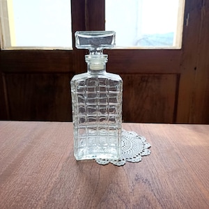 Transparent glass bottle of liquor