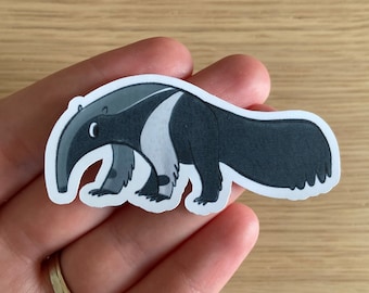 May include: A black and white cartoon sticker of an anteater with a long snout and a long tail. The anteater is walking on all fours.