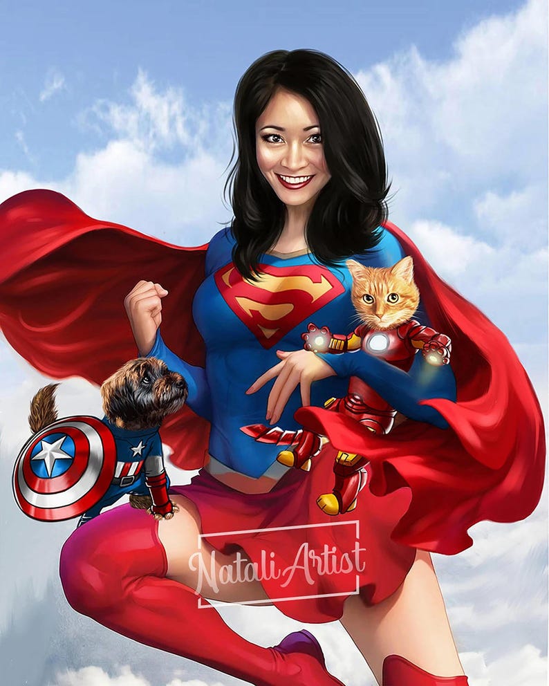 May include: A woman dressed as Superwoman with a red cape and blue and red costume, holding a cat dressed as Iron Man. A small dog wearing a Captain America costume is standing on her leg. The background is a blue sky with white clouds.