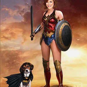 May include: A woman dressed as Wonder Woman stands with a sword and shield. A beagle dog wearing a Batman costume sits in front of her. The background is a sunset sky with clouds.