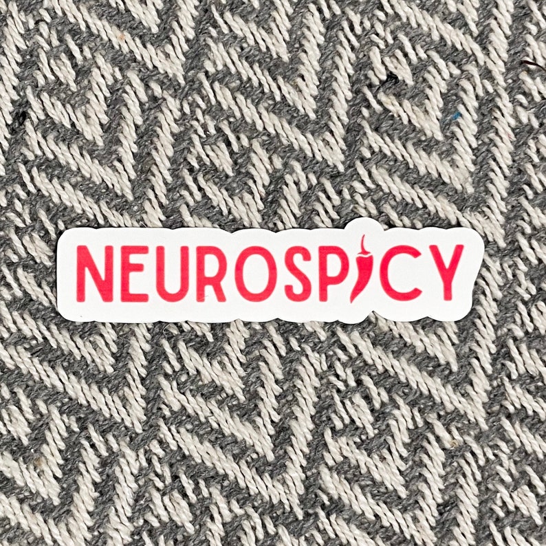 May include: A white sticker with the text "NEUROSPICY" in red letters and a red chili pepper icon.