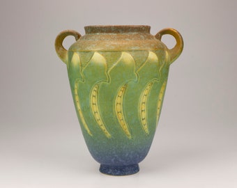 May include: A green and blue ceramic vase with two handles and a stylized leaf design.