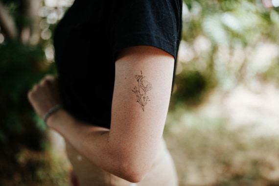 Poppy flower tattoo located on the bicep, fine line | Poppies tattoo, Poppy  flower tattoo, Petite tattoos