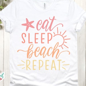 May include: White t-shirt with the text "eat sleep beach repeat" in pink, orange, and yellow. A starfish and a sun are included in the design.