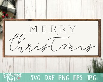 May include: A white wooden sign with a brown frame, featuring the text "Merry Christmas" in black script font.