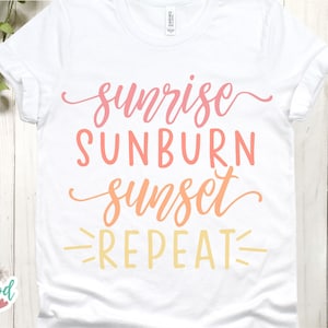May include: White t-shirt with the text "sunrise sunburn sunset repeat" in pink, orange, and yellow.