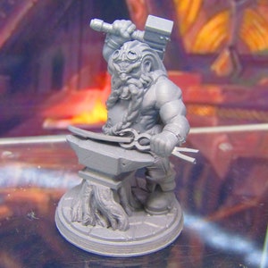 May include: A gray plastic miniature figurine of a dwarf holding a hammer and working on an anvil. The dwarf is wearing goggles and has a beard. The figurine is on a gray base.