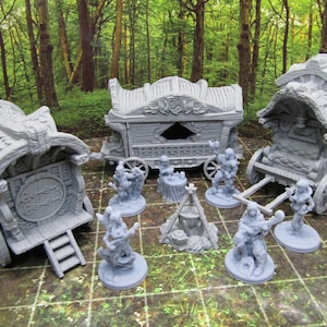 May include: Three gray wooden wagons with intricate carvings and details, including a small campfire and six miniature figures. The wagons are decorated with a variety of designs, including flowers, leaves, and other natural elements.
