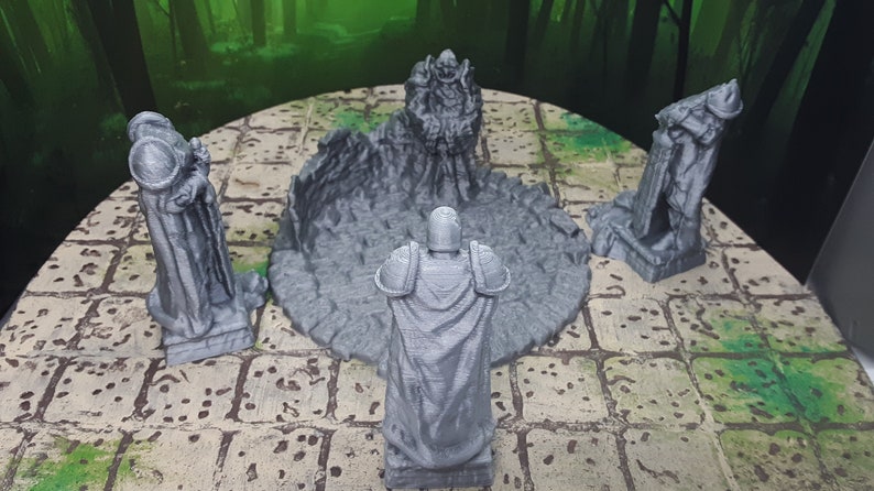 May include: Four gray 3D printed figurines standing around a circular base with a broken, cracked surface. The figurines are in various poses and appear to be wearing armor and robes.