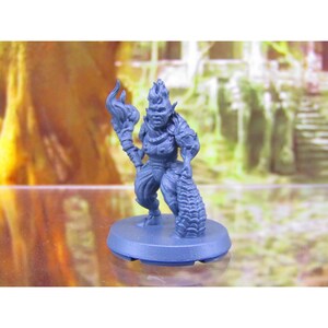 May include: A blue plastic miniature figurine of a goblin with a flaming torch and a sack of loot. The goblin is wearing armour and has a fierce expression.